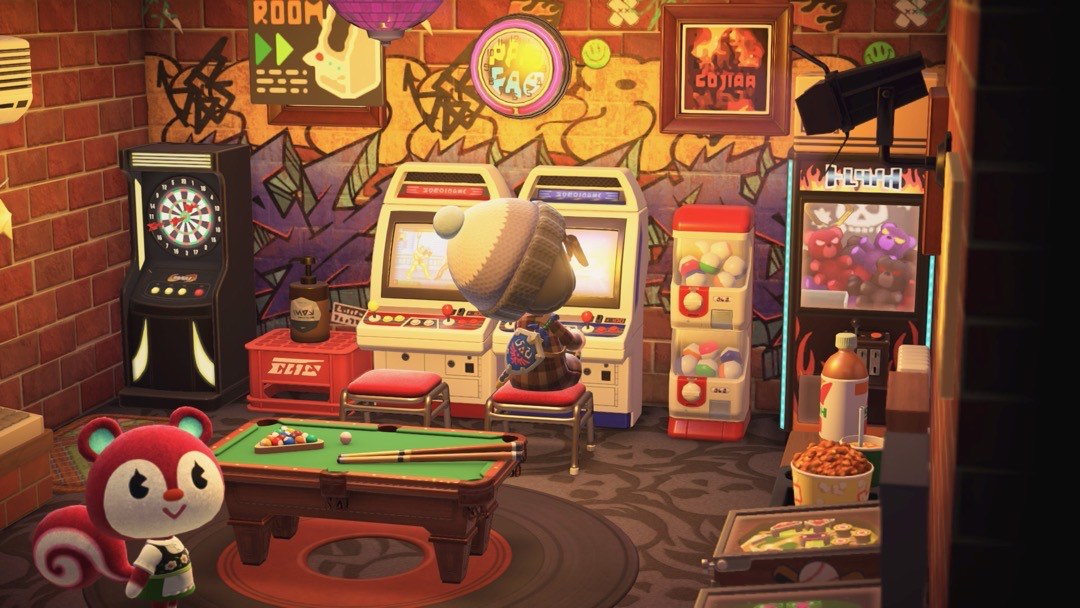 Eine Arcade, in der mein Avatar an einem Automaten spielt. Man sieht außerdem noch weitere Automaten, Pinball-Tische und einen Dartautomaten. Im Vordergrund schaut Poppy, das Eichhörnchen, in die Kamera.